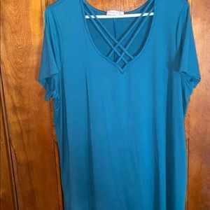 Soft jersey dress with crisscross pattern at neckline.